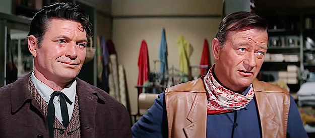 Chuck Roberson as Sheriff Jeff Lord and John Wayne as George Washington McLintock address two scoundrels in McLintock! (1963)