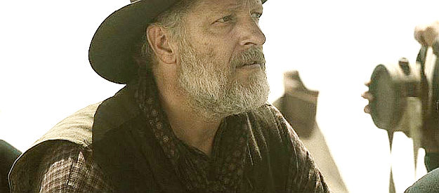Clancy Brown as John Clay, a frontiersman constantly confronting the cavalry commander in The Burrowers (2008)