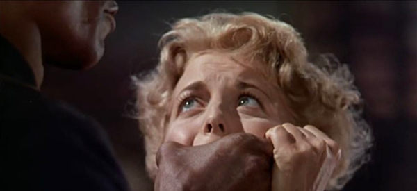 Constance Towers as Mary Beecher, Sgt. Rutledge's hand clasped across her mouth the keep her from screaming in Sergeant Rutledge (1960)