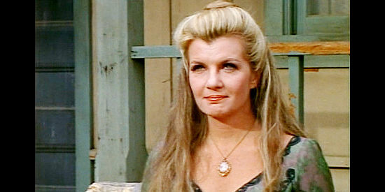 Corinne Calvet as Janice McKenzie, run out of town because of a bad reputation in Apache Uprising (1966)