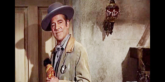 Dana Andrews as Johnny Reno, showing up in Nona Williams' room with Rosie Red Toes in Johnny Reno (1966)