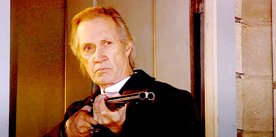 David Carradine as Ike Franklin, ordering soldier's off his son-in-law's property in Miracle at Sage Creek (2005)