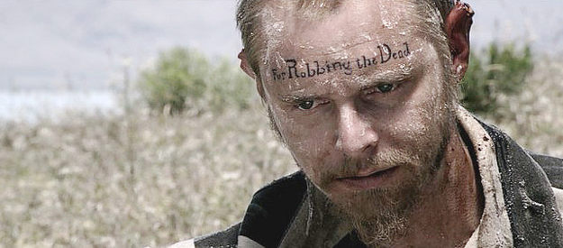 David Stevens as Jean Baptiste, bearing the marks of his crime in Redemption for Robbing the Dead (2011)