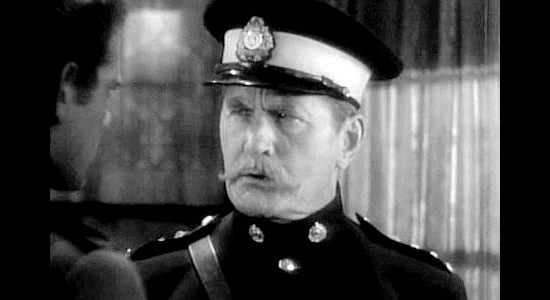 David Torrence as Inspector McDowell, ordering the man he believes is the married Sgt. Conniston out of his daughter's life in River's End (1930)