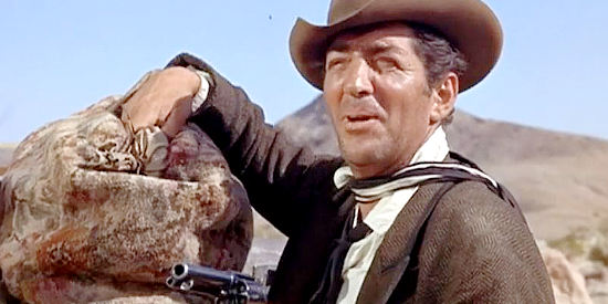 Dean Martin as Joe Jarrett, planning to claim $100,000 hidden in a stagecoach as his own in Four for Texas (1963)