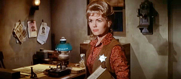 Debbie Reynolds as Lu Rogers, unexpectedly finding herself wearing a sheriff's badge in The Second Time Around (1961)