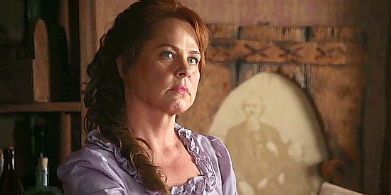 Deirdre Lovejoy as Sally Bates, the saloon owner tired of watching the Dowdys throw their weight around in Shadow on the Mesa (2013)