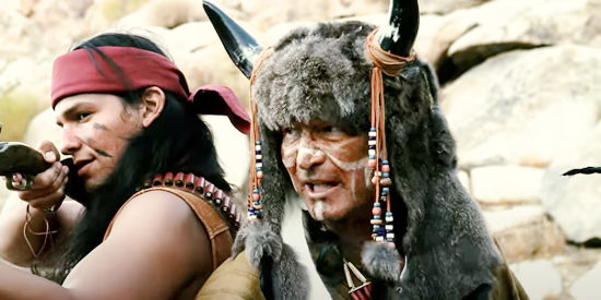 Dennis Ambriz as Falling Star, the war-mongering medicine man for the Black Claw in Cowboys and Indians (2011)