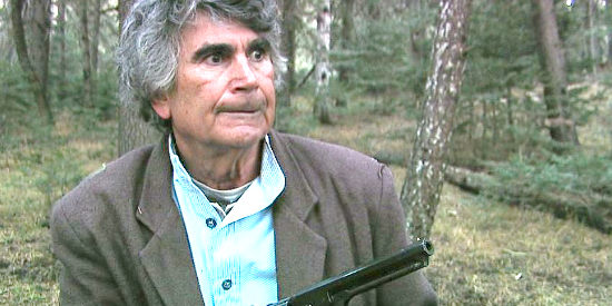 Dennis Cole as Stephen Bancroft, a peaceful man learning his wife is in danger in The Preacher and the Gun (2013)