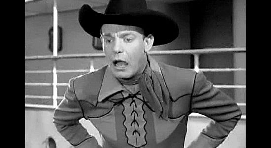 Dennis O'Keefe as William Quincy 'Wild Bill' Malone, realizing he's pushed the wrong woman into the water in The Kid from Texas (1939)