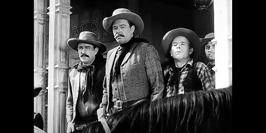 Dick Curtis as cattle king Cal Ryker with his men in Abilene Town (1946)
