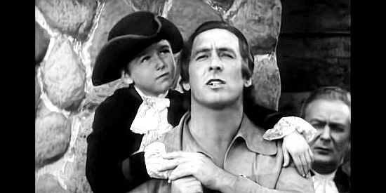 Dickie Jones as Jerry Randolph and George O'Brien as Daniel Boone, celebrating the dedication of Boonesborough in Daniel Boone (1936)
