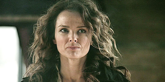 Dina Meyer as Calathea Massey, offering to help Guerrero seek his vengeance and get a measure of her own in Dead in Tombstone (2013)