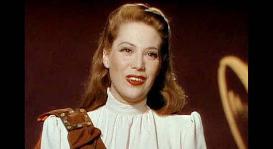 Dinah Shore as Lettie Candless, singing about love and about to have her heart broken in Belle of the Yukon (1944)