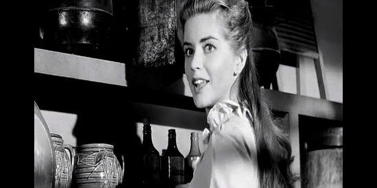 Dolores Hunt as Ellie Walters, happy to see her favorite customer, Sam Christy, in The Plunderers (1960)