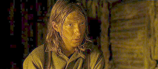 Dombnall Gleeson as Moon, one of the outlaws Rooster finds taking refuge in a cabin in True Grit (2010)