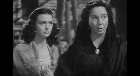 Donna Reed as Rosalia Martinez and Connie Gilchrist as her mother, preparing to leave Tonto Valley when Tom Folliard returns in Apache Trail (1942)