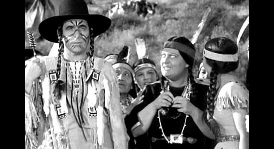 Douglass Dumbrille as Jake Rainwater, promising to arrange a bow-and-arrow wedding for Moonbeam (Jody Gilbert) in Ride 'Em Cowboy (1942)