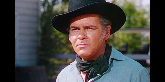 Edmund MacDonald as Farlane, Matthew Bostel's foreman, dealing with Lucy's stubborn nature in Red Canyon (1949)