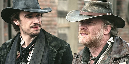 Edward Akrout as Snake and Anthony Michael Hall as Red Cavanaugh, realizing trouble might have come back from the grave in Dead in Tombstone (2013)