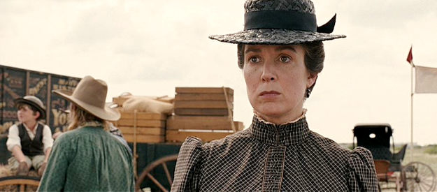Elizabeth Marvel as an older Mattie, visiting a Wild West show and hoping for a reunion with Rooster in True Grit (2010)