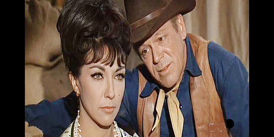 Elsa Cadenas as Consuela Stark, reconsidering her alliance with Jay Jason (Dan Duryea), to his displeasure in Taggart (1964)