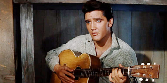 Elvis Presley as Pacer Burton, wondering which side his family has the most to fear from in Flaming Star (1960)