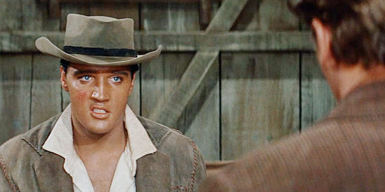 Elvis Presley as Pacer, announcing that he's decided to take the Kiowa side in the upcoming fight in Flaming Star (1960)