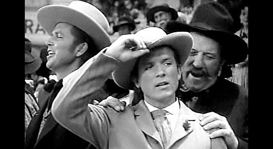 Eric Linden as Johnnie Warren, waiting for his bride-to-be to arrive by stage in Robin Hood of El Dorado (1936)