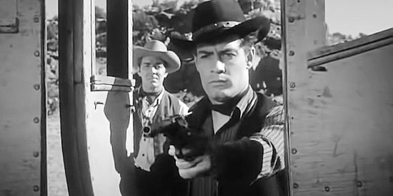 Eric Matthews as Johnny Sims, gunning down a female stagecoach passenger in Convict Stage (1965)