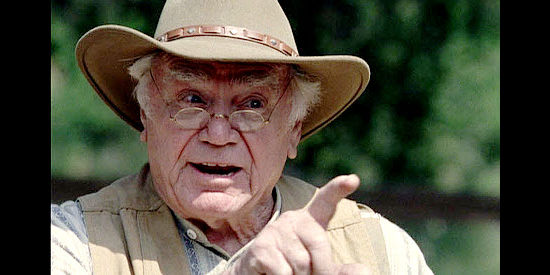 Ernest Borgnine as Eugene Lawson, making a poing with Samuel Drigger in The Trail to Hope Rose (2004)