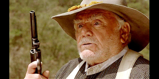 Ernest Borgnine as Lucas Moat, determined to avenge a son's death in The Long Ride Home (2003)