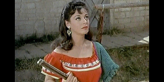 Estelita Rodriguez as Juanita Lopez, armed and ready to protect her home and her man in Jesse James Meets Frankenstein's Daughter (1966)