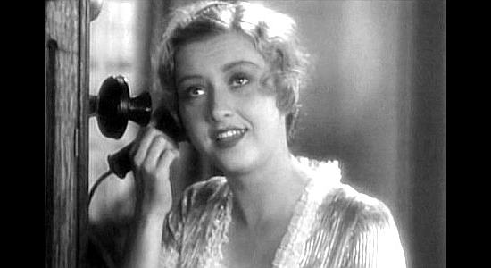Evalyn Knapp as Miriam McDowell, learning th admirer she was about to reject has returned from a manhunt a changed person in River's End (1930)