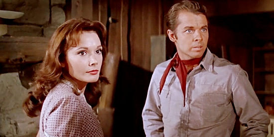 Felicia Farr as Janet and Audie Murphy as Clay Santell, reacing to unexpeced visitors in Hell Bent for Leather (1960)