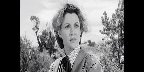 Frances Dee as Fay Hollister, learning the truth about Ross McEwen's recent past in Four Faces West (1948)