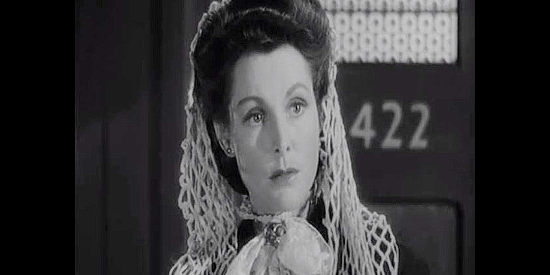 Frances Dee as Faye Hollister, the traveler who catches Ross McEwen's attention in Four Faces West (1948)