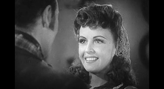 Frances Gifford as Abigail 'Abby' Taylor, the woman who wins Paxton's heart but is leery of his ambition in American Empire (1942)