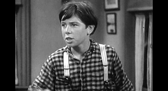 Frank Coghlan Jr. as Mickey O'Toole, spotting 'Conni's' whip scars and realizing something is amiss in River's End (1930)