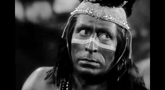 Frank Hill as Mano, the Indian chief who negotiates a gun deal with Ward and Carteret in Arizona (1940)