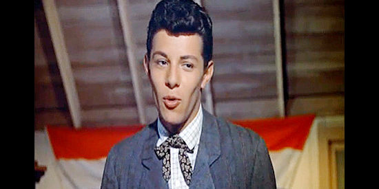 Frankie Avalon as Bert Harvey, showing off his singing chops at a town dance in Guns of the Timberland (1960)
