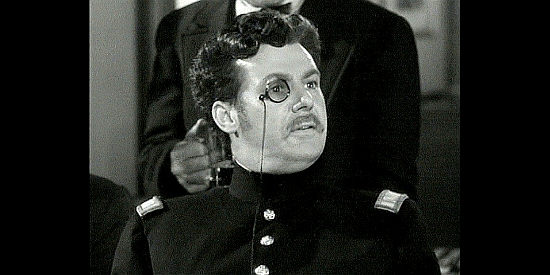 G.P. Huntley as Lt. Queens Own Butler, introducing Custer to Garry Owen in They Died with Their Boots On (1941)