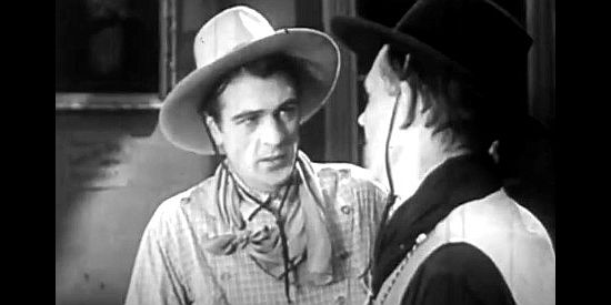Gary Cooper as the Virginian, at odds with Trampas again in The Virginian (1929)
