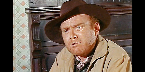 Gene Evans as Jess Cooney, questioning Vance's plans to kill all the stage passengers in Apache Uprising (1966)