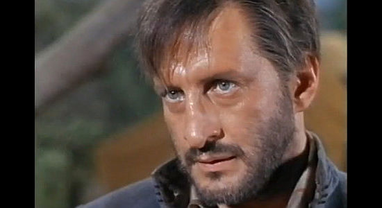 George C. Scott as Jud Barker, leader of the Confederate raiders who terrorize Lawrence, Kansas, in This Savage Land (1969)