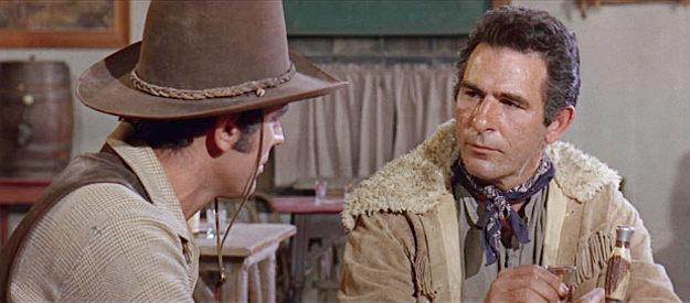 George Keymas as Montana, being recruited as the new leader of the outlaw gang after Quantrell's death in Arizona Raiders (1965)