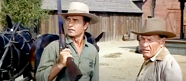 George Montgomery as Gid McCool, taking one two more prisoners for Sheriff Travis (Richard Arlen) in Hostile Guns (1967)