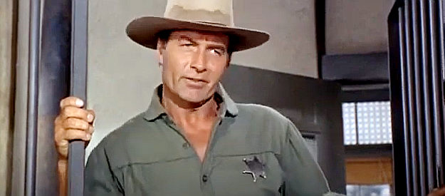 George Montgomery as Gid McCool, trying to talk young Mike Reno into being his deputy in Hostile Guns (1967)