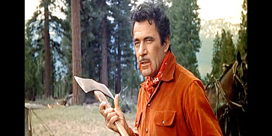 Gilbert Roland as Monty Walker, prepared to use an axe if need be to get his way in Guns of the Timberland (1960)