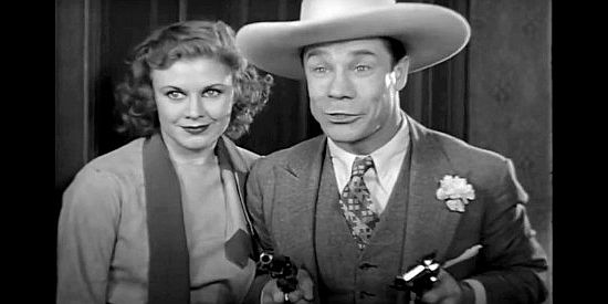 Ginger Rogers as Ruth Western and Joe E. Brown as Calvin Jones, showing off his six-guns in The Tenderfoot (1932)